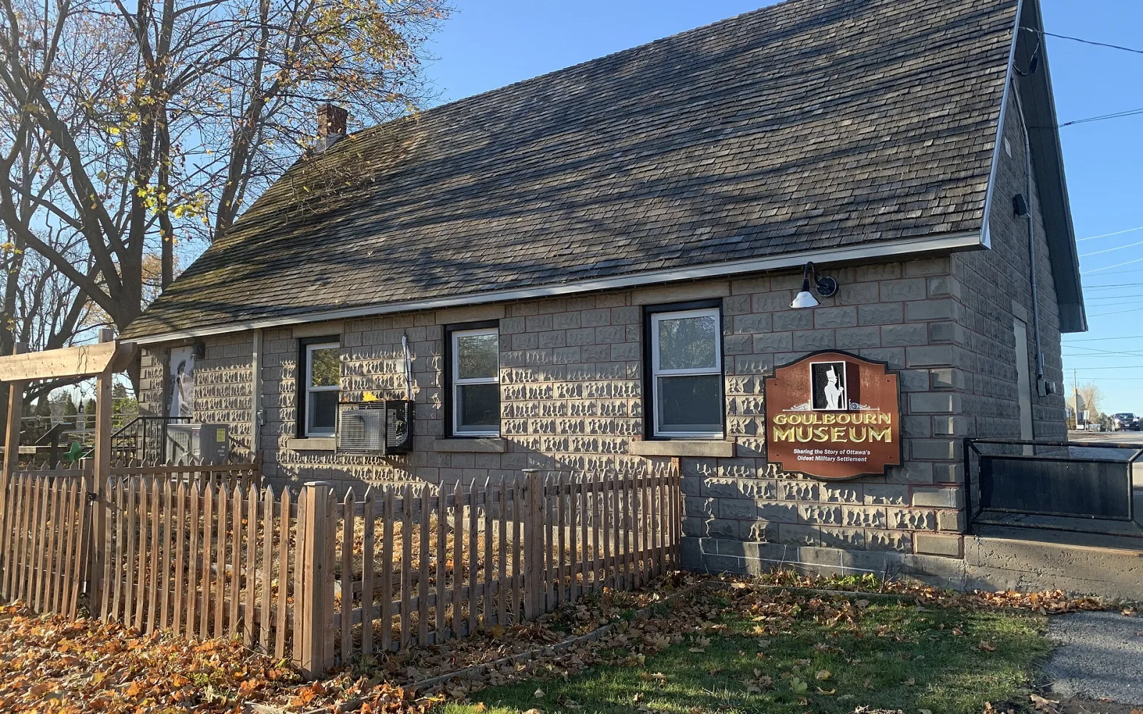Goulbourn Museum building in Stittsville surrounded by autumn leaves