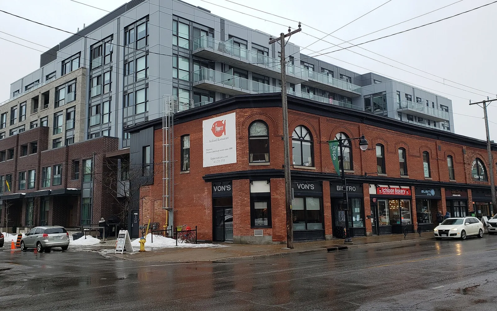Historic brick storefronts and newer apartments at Bank Street and Fourth Avenue in the Glebe